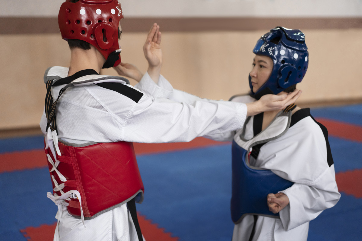 People practicing taekwondo gymnasium